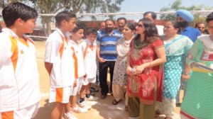 Deputy Director Youth Services and Sports Jammu, Kanchan Bala interacting with budding spikkers during inaugural ceremony of Volleyball Tournament at HSS Akhnoor.