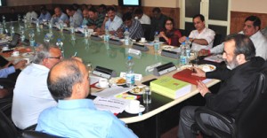 Chief Secretary Mohd Iqbal Khandey chairing High Powered Committee meeting at Srinagar on Friday.