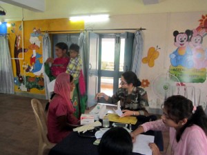 Team of doctors examining a patient during a medical camp organized by Army.