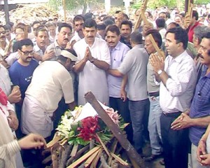 Member Parliament Jugal Kishore and others attending last rites of KP leader H L Chatta in Jammu.