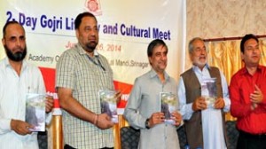 Minister for Forests, Mian Altaf Ahmad and others releasing Gojri publications at Srinagar on Wednesday. 