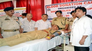 Police official donating blood during Blood Donation Camp at DPL Udhampur on Tuesday.