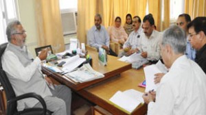 Minister  for Health, Taj Mohi-ud-Din chairing a meeting at Srinagar on Monday.