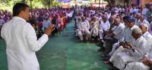 Minister for PHE, Sham Lal Sharma addressing public gathering in Akhnoor tehsil on Thursday.