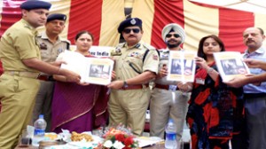 DIG Jammu Shakeel Beig alongwith police officers and members of Help Age India releasing report on “Elder Abuse in India (2014)” at Old Age Home, Ambphalla on Friday.