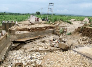 A view of damaged ‘Puli’ and road on Mishriwalla-Kangrail link due to flood in Jammu on Thursday. Another pic on page 6. -Excelsior/Rakesh