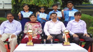 School management posing along with cagers after winning third place in WAC Inter Air Force School Basketball Championship. 