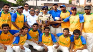 Jubilant winners posing for a group photograph alongwith DIG Jammu, Shakeel Beig in Jammu on Monday.