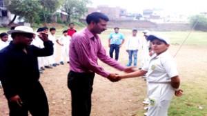Former Ranji Trophy player, Rajesh Gill interacting with budding cricketers during U-14 boys cricket series in Jammu.