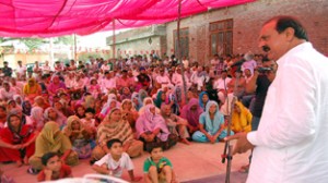 Former minister Surjeet Singh Slathia addressing public in Vijaypur.