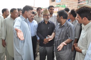 Minister for Rural Development Ali Mohd Sagar interacting with people during his visit to various areas of Srinagar on Saturday.