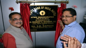 SMVDSB CEO Dr M K Bhandari and SBI Regional Head S K Kapoor inaugurating ATM at Katra on Tuesday.