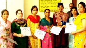 Trainees receiving certificates from DC Udhampur, Yasha Mudgal.