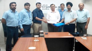 The officials of Grameen Bank and Maruti Suzuki India Limited while renewing MoU on Saturday.