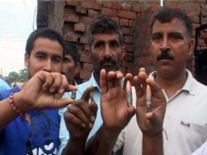 People showing bullets which landed in their houses at Abdullian in R S Pura sector on Sunday. -Excelsior/Rakesh