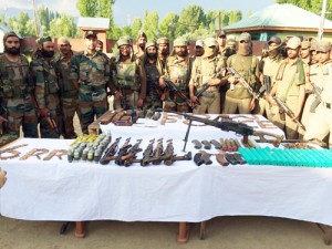 Arms and ammunition recovered by 6 RR and Handwara police from Hafrada forest.—Excelsior/Aabid Nabi