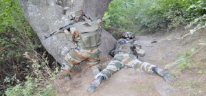 Army jawans in action during encounter with militants at Kalaroos in Kupwara on Saturday. —Excelsior/Aabid Nabi