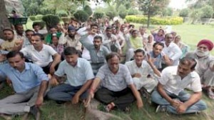 NMC president Subash Shastri along with workers raising slogan in support of their demands on Sunday. -Excelsior/ Rakesh