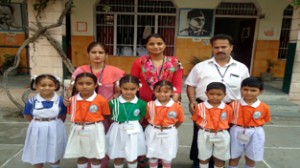 Winners of poem recitation competition posing alongwith school staff.