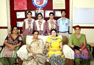 Badminton players of Model Academy posing alongwith the School Management.