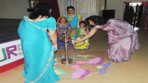 Chief guest lighting traditional lamp during Annual Day celebration at Kalidhar Memorial Army School.