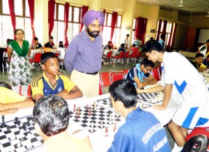 Players busy in making moves during chess competition.