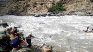 Armymen undertaking rescue operation along Suru river.