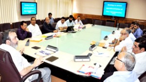 Chief Secretary, Mohammad Iqbal Khandey chairing a meeting at Srinagar on Thursday.