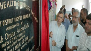 Chief Minister Omar Abdullah and Minister for Health Taj Mohi-ud-Din inaugurating CT Scan at District Hospital Baramulla on Monday.