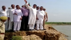 Jugal Kishore Sharma during his visit to flood hit areas of Vijaypur on Thursday. —Excelsior/Gautam