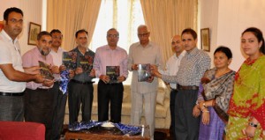 Governor NN Vohra and others releasing a book at Raj Bhavan on Wednesday. 