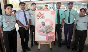 Officials of McDonald’s during launching of three new variants of saucy wraps at Jammu on Wednesday.    —Excelsior/Rakesh