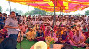 JSM MLA Ashwani Sharma addressing a rally at Bishnah on Sunday.