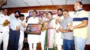 MLC Jugal Kishore Sharma releasing video DVD ‘Jaagey Wali Raat’ at KL Saigal Hall, Jammu on Sunday.