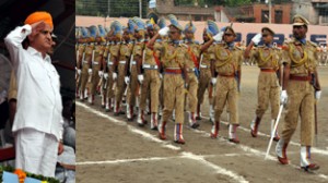 Deputy Chief Minister Tara Chand taking salute at March Past during Independence Day Parade at Mini-Stadium Jammu.