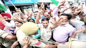 Displaced persons from PoJK staging protest near Press Club in Jammu on Thursday. -Excelsior/Rakesh