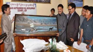 CEC presenting a memento to Ambassador of Mangolia at Leh on Tuesday.