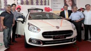 MD of National Fiat Jammu, Chander Gulati and Mr Bhatia, President Fiat India Ltd along with Company Directors at launch of new Punto Evo in Jammu on Tuesday. -Excelsior/Rakesh 
