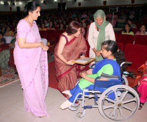 President of AWWA presenting a gift of physically challenged girl.