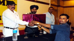 A dealer receiving gift from the officials of Khaitan Electrical Limited on Thursday.