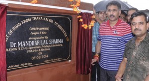 Minister of State for Planning, Dr Manohar Lal Sharma inaugurating link road at Kathua on Tuesday.