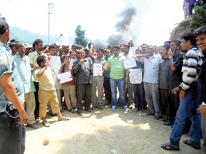 People raising slogans during protest at village Chiralla in Tehsil Thathri. -Excelsior/Tilak Raj