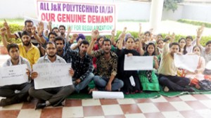 Contractual lecturers of Polytechnics staging protest at Jammu on Monday.