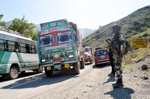 Stranded vehicles being cleared on the National Highway after it was restored for traffic on Tuesday.—Excelsior/ Sajad Dar