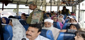 Stranded PoK people on way back home in Special Muzaffarabad bus on Friday.              —Excelsior/Aabid Nabi