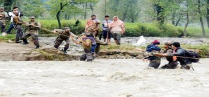 Army jawans rescue people from flood waters in Srinagar on Tuesday.