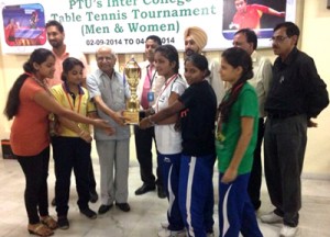 Players of women’s team of IET Bhaddal receiving trophy from the chief guest.