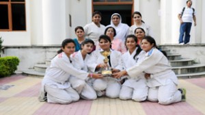 Judo team of GCW Parade, Jammu who won Inter-Collegiate Judo Championship organised by JU, posing with principal of the college and other faculty members at Jammu.