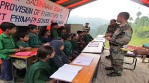 Army officers donating furniture and other items to school children at Mithidhara in Rajouri.