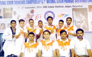 Atul Kumar Pangotra and other Taekwondo medal winners posing for a group photograph.